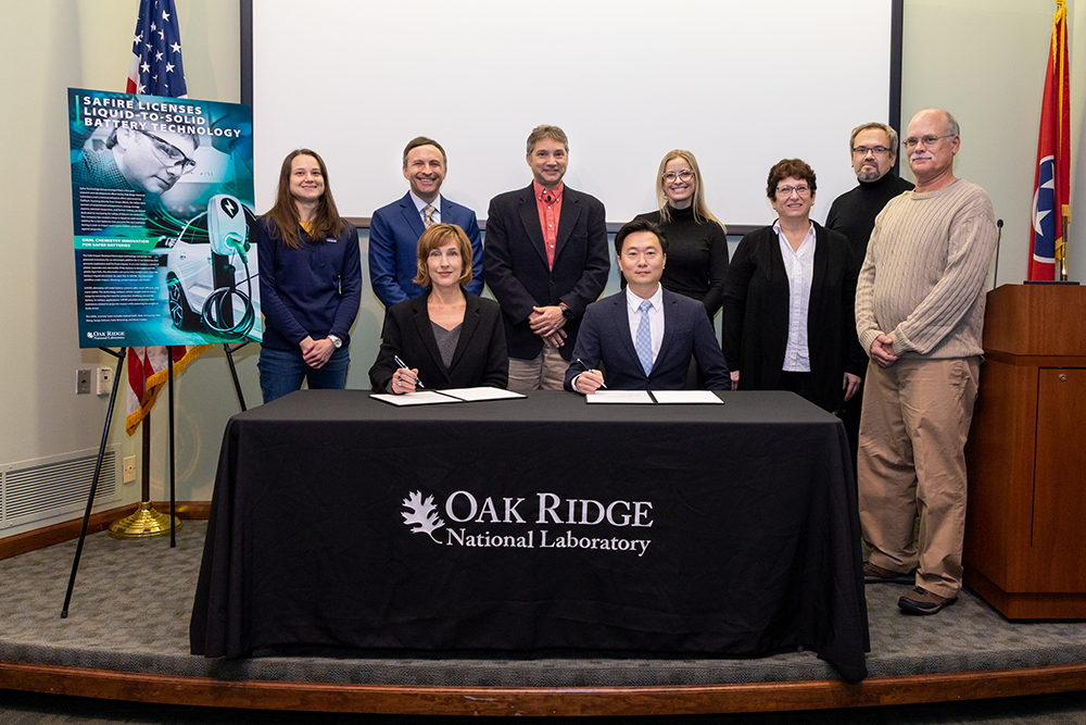 ORNL inventors and Safire Technology Group leadership attended a licensing event at the lab on Nov. 15. Standing, from left to right, are Katie Browning, Mike Grubbs, Gabriel Veith, Hayley Kleciak, Beth Armstrong, Sergiy Kalnaus and Kevin Cooley. Seated are Susan Hubbard and John Lee. Credit: Genevieve Martin/ORNL, U.S. Dept. of Energy