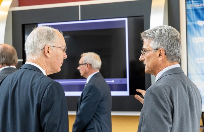 John Galambos (right) talks about neutron science with Illinois Congressman Bill Foster in 2019 at the Spallation Neutron Source.