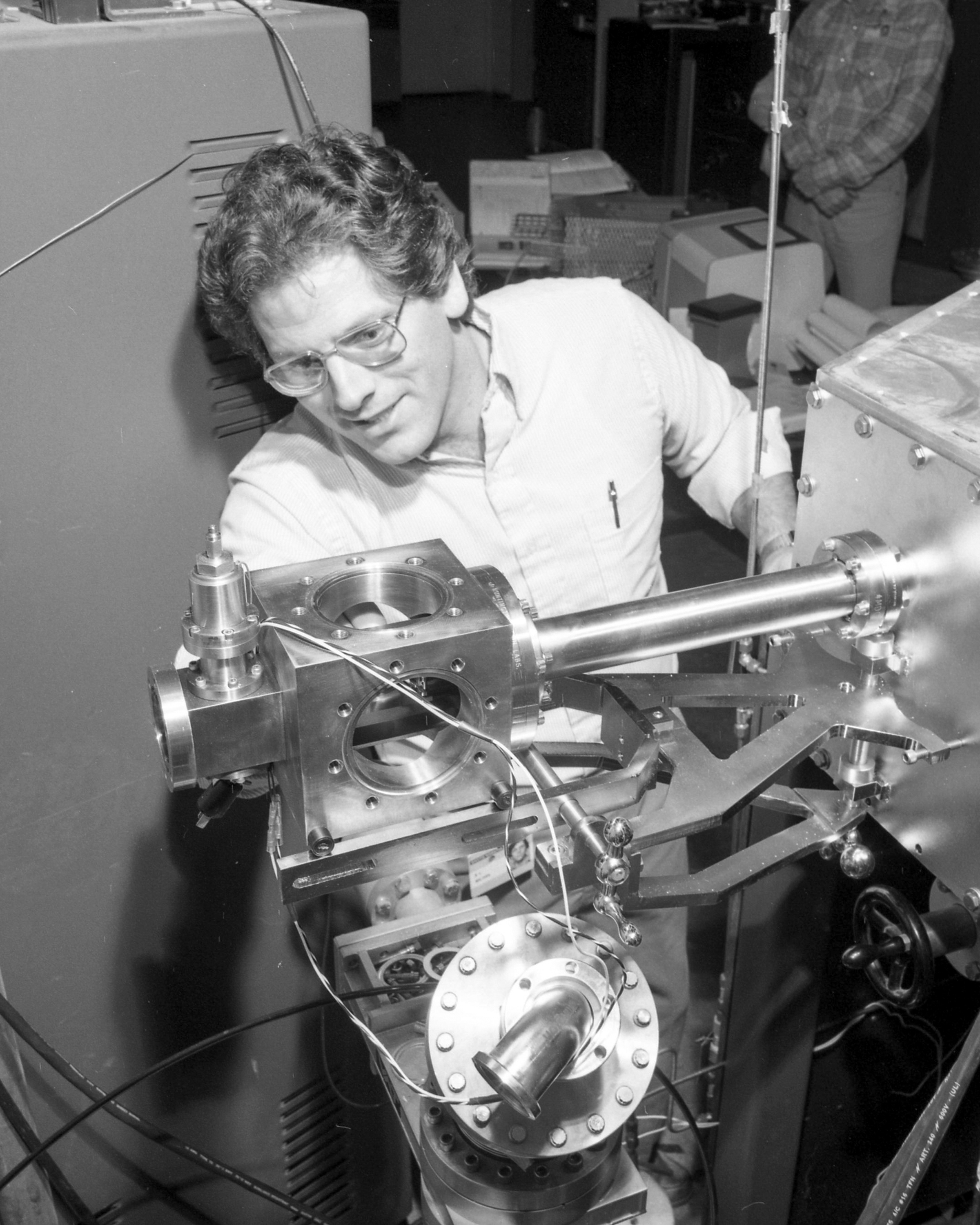 ORNL researcher Stan Milora working on a pneumatic pellet injector