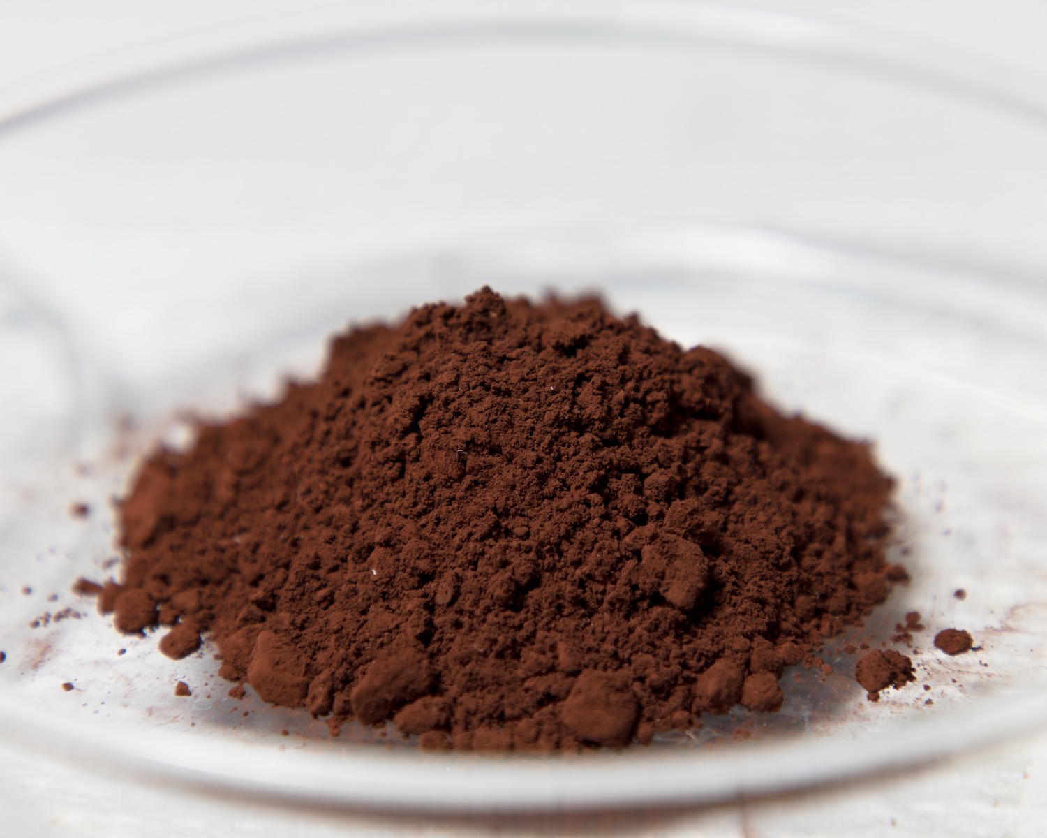 Dark brown powder that is a rare earth element that has been refined into powder