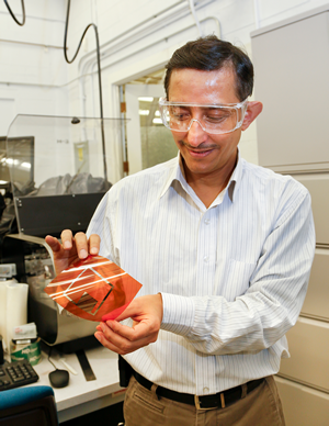 ORNL researchers are experimenting with additive roll-to-roll manufacturing techniques to develop low-cost wireless sensors. ORNL's Pooran Joshi shows how the process enables electronics components to be printed on flexible plastic substrates.
