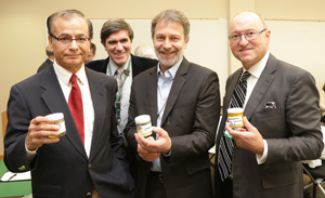 Vertimass LLC, a California-based start-up company, has licensed an Oak Ridge National Laboratory technology that directly converts ethanol into a hydrocarbon blend-stock for use in transportation fuels. ORNL inventors (from left) Chaitanya Narula, Brian Davison and Martin Keller display the technology with Vertimass chairman William Shopoff.  
