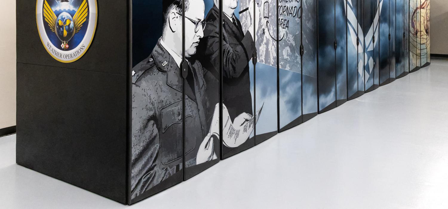The Air Force weather forecasting system with graphics of the AF Weather Wing, photograph of two men, and storm clouds.