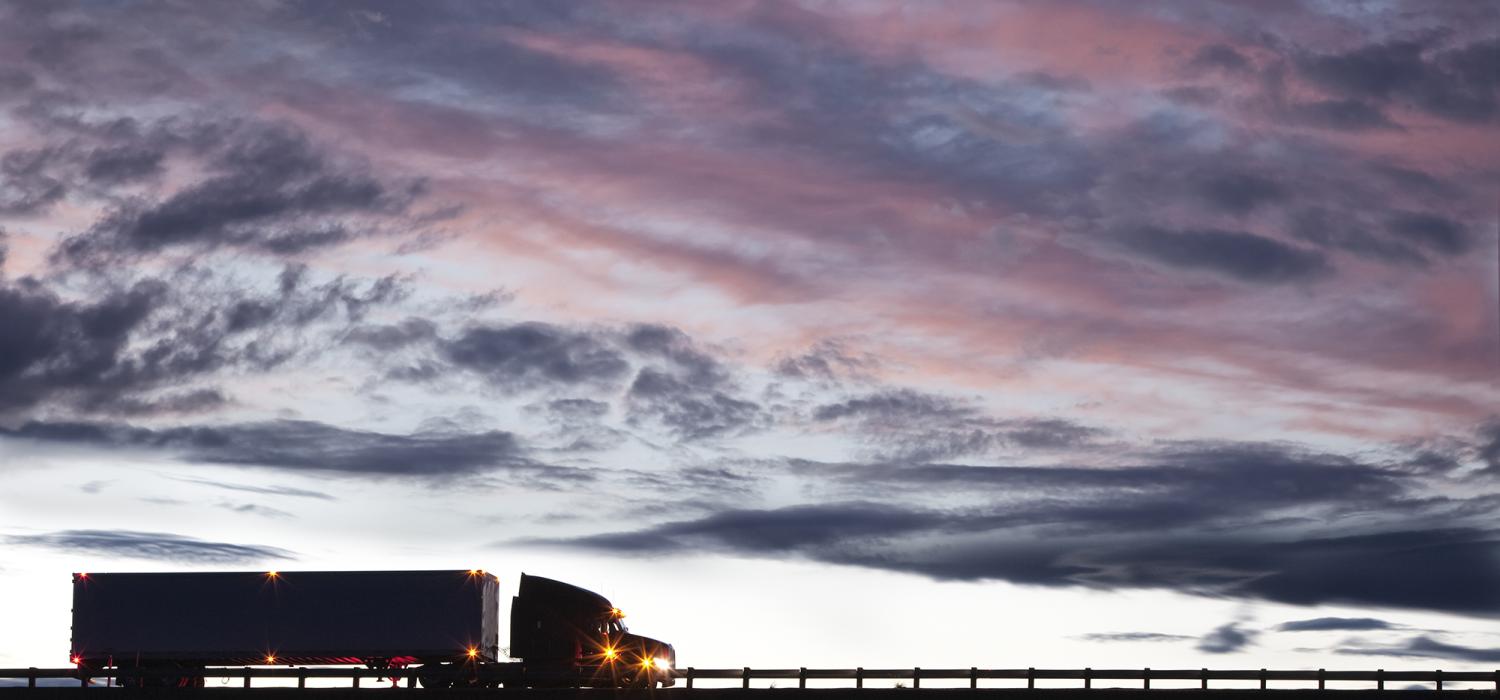 Heavy truck against cloudy sky