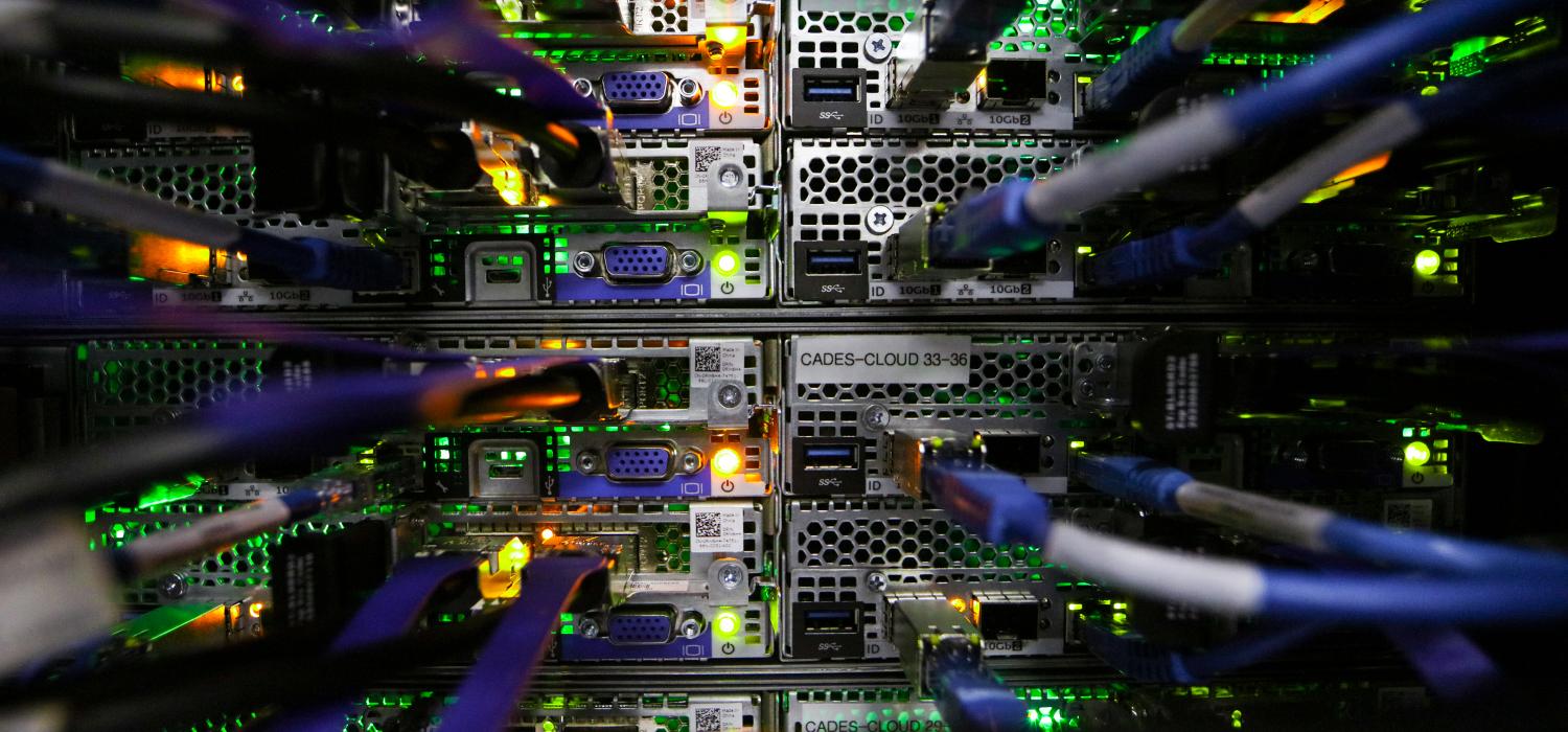 Cables and wires plugged into compute nodes.