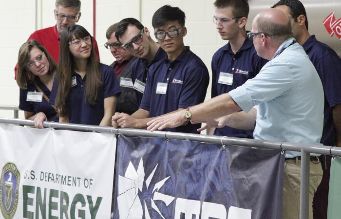 ORNL’s Lonnie Love, far right, explains the potential impact of additive manufacturing research and development to a student engineering team from the University of Illinois at Urbana-Champaign who toured DOE’s Manufacturing Demonstration Facility at ORNL