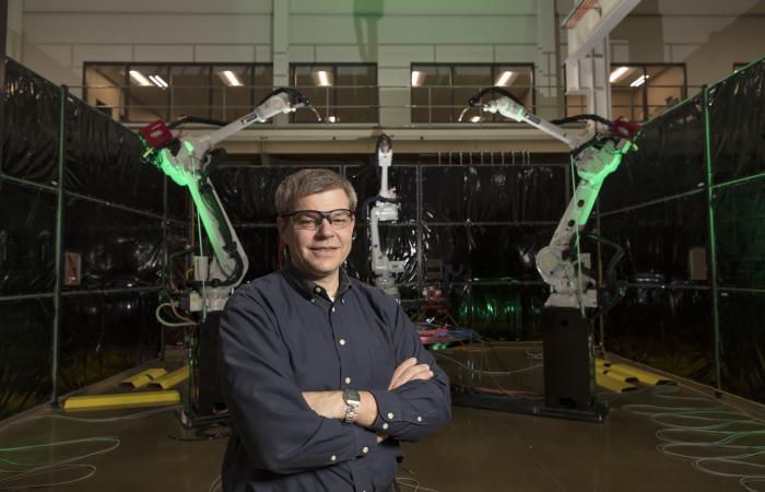 Tom Kurfess standing in front of MedUSA equipment