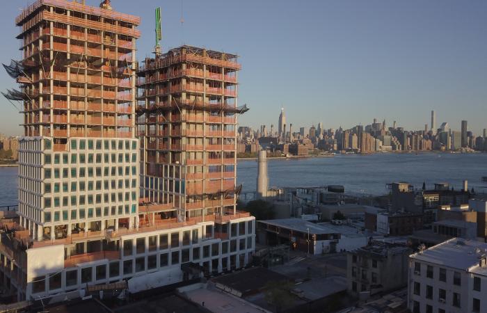 The concrete parts are installed in a residential and commercial tower (above center and below) on the site of the Domino Sugar Factory along the waterfront in Brooklyn. Windows in the tower resemble sugar crystals. Image credit: Gate Precast