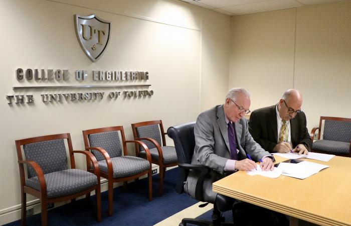 Representatives from The University of Toledo and the U.S. Department of Energy’s Oak Ridge National Laboratory (ORNL) in Tennessee are teaming up to conduct collaborative automotive materials research.” Credit: University of Toledo