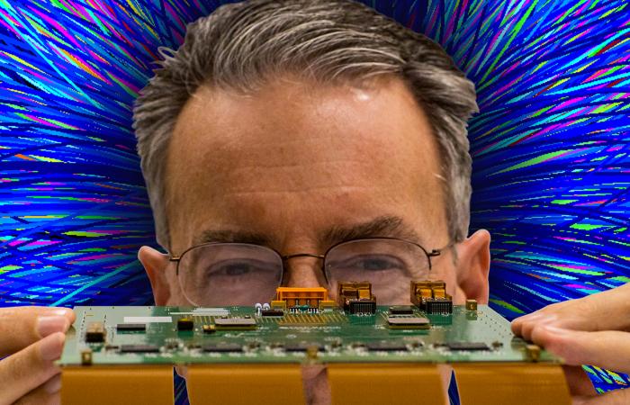 Kenneth Read led design, fabrication and assembly of ALICE’s upgraded electronics hardware. Background: CERN. Foreground: Oak Ridge National Laboratory, U.S. Dept. of Energy; photographer Carlos Jones, composition Brett Hopwood.