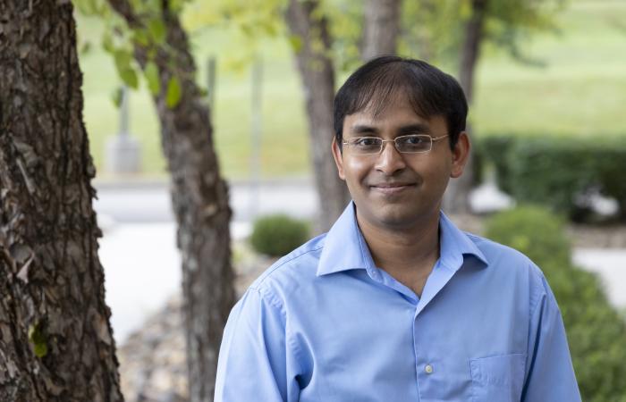 Suman Debnath is using simulation algorithms to accelerate understanding of the modern power grid and enhance its reliability and resilience. Credit: Carlos Jones/ORNL, U.S. Dept. of Energy