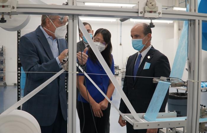 U.S. Department of Energy Deputy Secretary Mark Menezes (right) tours the DemeTECH N95 filter material production area with Xin Sun, ORNL interim associate laboratory director (center) and Craig Blue, ORNL advanced manufacturing program manager. Credit: US Dept. of Energy