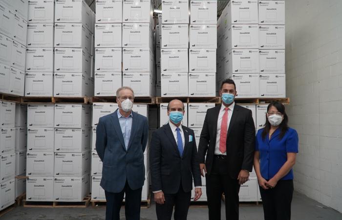 U.S. Department of Energy Deputy Secretary Mark Menezes (second from left) at the DemeTECH N95 mask production facility in Miami, Florida, with left to right, Craig Blue, ORNL advanced manufacturing program manager; Luis Arguello, Jr., vice president of DemeTECH; and Xin Sun, ORNL interim associate laboratory director. Credit: U.S Dept. of Energy