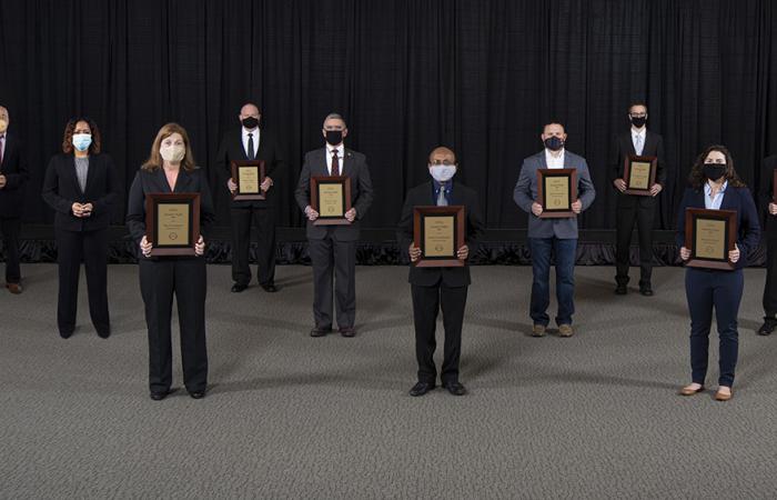 The Director’s Award for a Mission Support team went to, on first row, Tina Summers, Parans Paranthaman and Emma Betters. On the second row are Merlin Theodore, Peter Lloyd, Jason Newport, and Tony Reynolds. On the third row are Peter Tsai, Kim Sitzlar and Gregory Larsen. Not pictured: Jesse Heineman. Credit: Carlos Jones/ORNL, U.S. Dept. of Energy