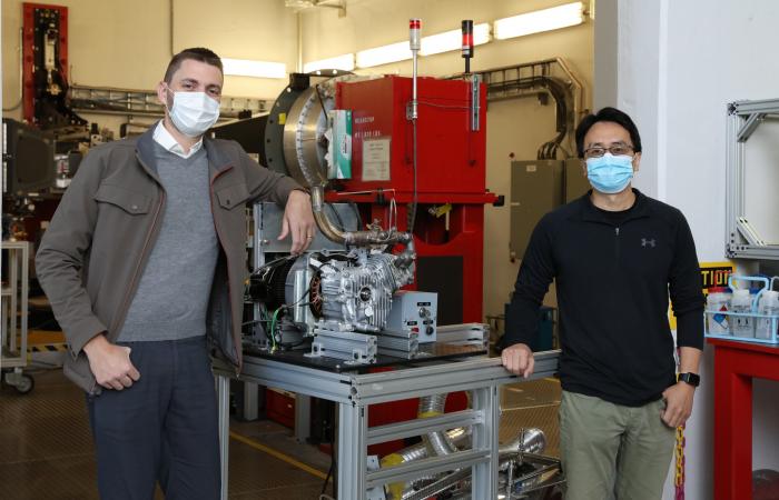 Researchers Martin Wissink, left, and Ke An worked with colleagues to design and test a running combustion engine prototype in the VULCAN beamline at the Spallation Neutron Source at ORNL, proving a new, non-destructive capability to analyze materials for advanced vehicles at the atomic level in a realistic setting. Credit: Genevieve Martin/ORNL U.S. Dept. of Energy.