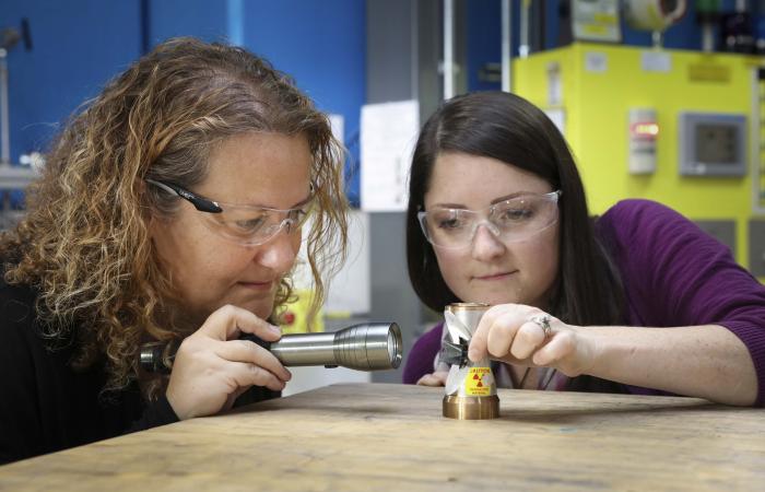 ORNL's Bianca Haberl and Amy Elliott hold 3D-printed collimators - an invention that has been licensed to ExOne, a leading binder jet 3D printer company. Credit: Genevieve Martin/Oak Ridge National Laboratory, U.S. Dept. of Energy