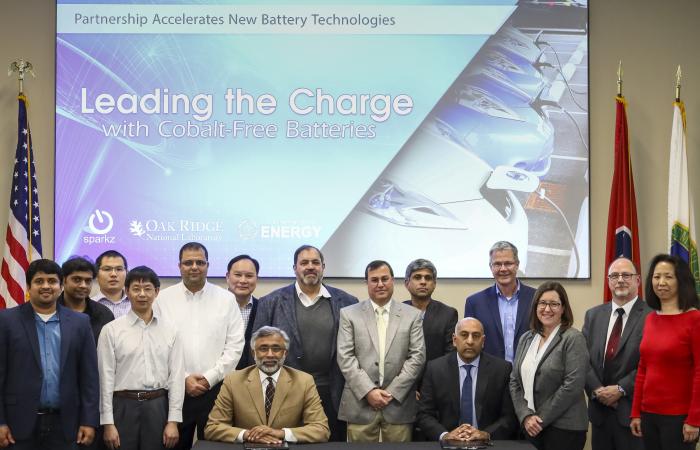 The ORNL research team that developed and licensed a suite of battery technologies to energy storage startup SPARKZ is shown during the official licensing ceremony with Director Thomas Zacharia. The technologies, designed to eliminate the use of cobalt in lithium-ion batteries, were recognized with a 2021 FLC award for Excellence in Technology Transfer. Credit: ORNL, U.S. Dept of Energy
