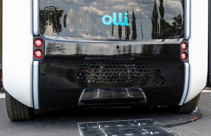 ORNL researchers installed and demonstrated their wireless charging technology for the first time on an autonomous vehicle – the Local Motors Olli shuttle bus. Credit: Carlos Jones/ORNL, U.S. Dept. of Energy