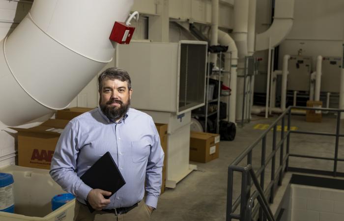 ORNL’s Jason DeGraw, a mechanical engineer and indoor air quality expert, uses numerical equations powered by high-performance computing to analyze and solve problems related to the dispersion patterns of biological pathogens as well as chemical irritants in buildings. Credit: ORNL, U.S. Dept. of Energy