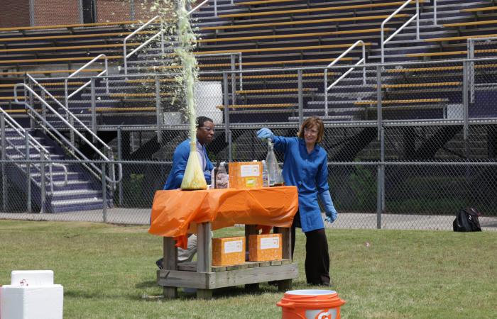 ORNL's Susan Hubbard, right, and COSI's Stephen White conducted a larger-than-life science experiment called elephant toothpaste. Credit: Genevieve Martin/ORNL, U.S. Dept. of Energy