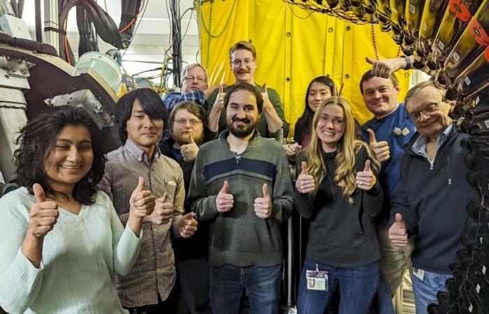 ORNL’s Krzysztof Rykaczewski, far right, led a multiorganizational team to deploy the Modular Total Absorption Spectrometer, under yellow lead shield. Credit: Kelly Chipps/ORNL, U.S. Dept. of Energy
