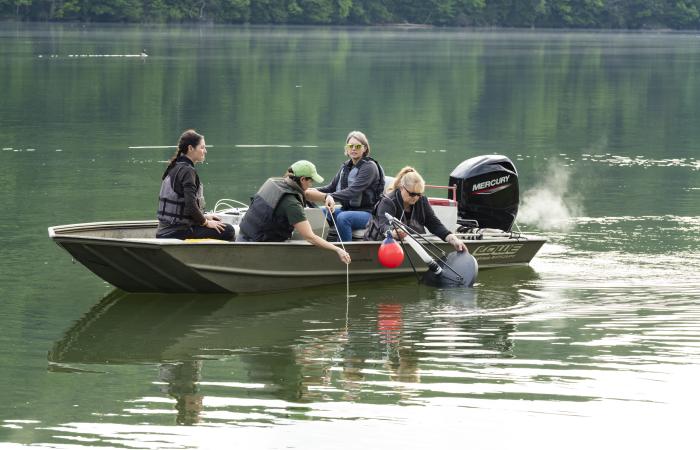 ORNL researchers deploy a gas trap to measure ebullitive (bubbling) emissions of methane at the Melton Dam in East Tennessee. The trap is deployed for ~ 24 hours to allow gas to accumulate in the trap. Credit: Carlos Jones/ORNL, US Dept. of Energy