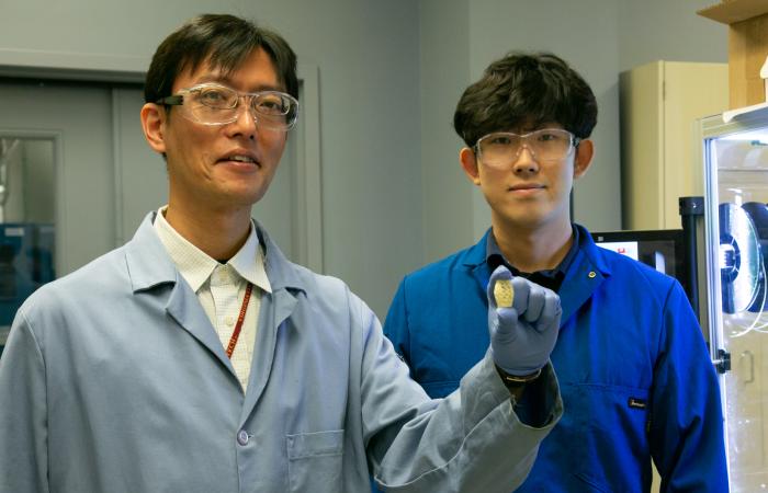 ORNL polymer scientists Tomonori Saito (left) and Sungjin Kim upcycled waste plastic to create a stronger, tougher, solvent-resistant material for new additive manufacturing applications. Credit: Genevieve Martin/ORNL, U.S. Dept. of Energy