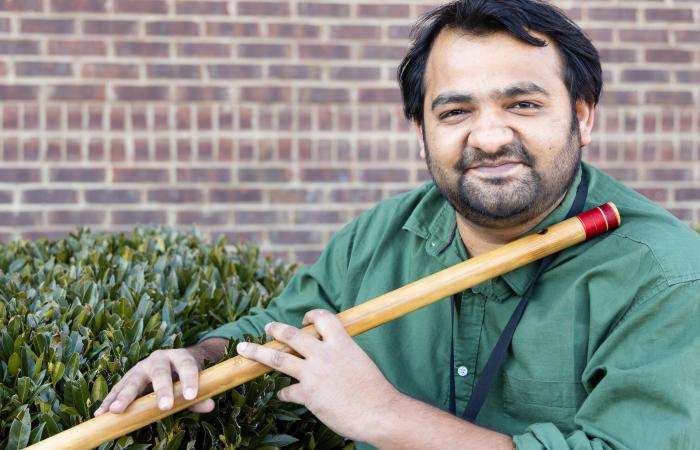 When he’s not conducting research in ORNL’s Battery Manufacturing Facility, Dixit enjoys recharging his own battery by playing the flute, a classical Indian tradition. Credit: ORNL, U.S. Dept. of Energy