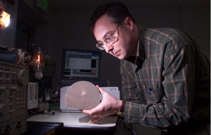 Bill Partridge, in the early days of his research career, worked on a mass spectrometer to analyze diesel fuel hydrocarbons. Credit: ORNL, U.S. Dept. of Energy