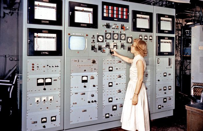 ORNL physicist Libby Johnson demonstrated a new control panel at ORNL’s Bulk Shielding Facility in 1957. Among the first females to operate a nuclear reactor, Johnson blazed trails for women. Credit: ORNL, U.S. Dept. of Energy