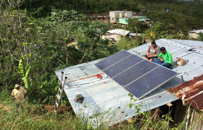 Solar panels installed on commercial buildings create independent microgrids in Adjuntas, Puerto Rico. Researchers at Oak Ridge National Laboratory are developing a new technology to manage how the microgrids work together. Credit: Fabio Andrade