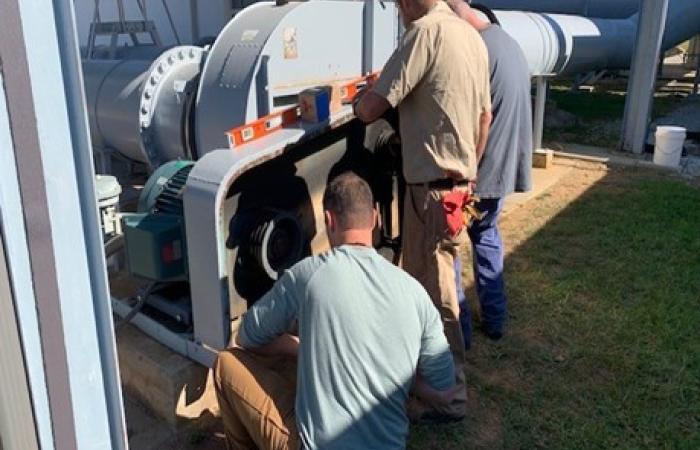 Craft workers repair vital equipment.