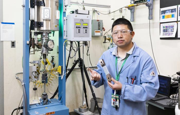 Yiyu Wang, a scientist in Feng’s group, tests and characterizes materials to determine how welding affects microstructure. His work proves the weld wire lowers stresses. Credit: Carlos Jones/ORNL, U.S. Dept. of Energy