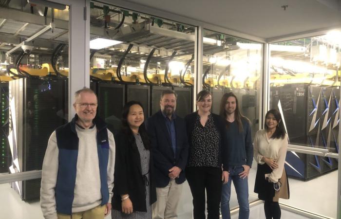 Team members from ORNL and the VA in front of Summit