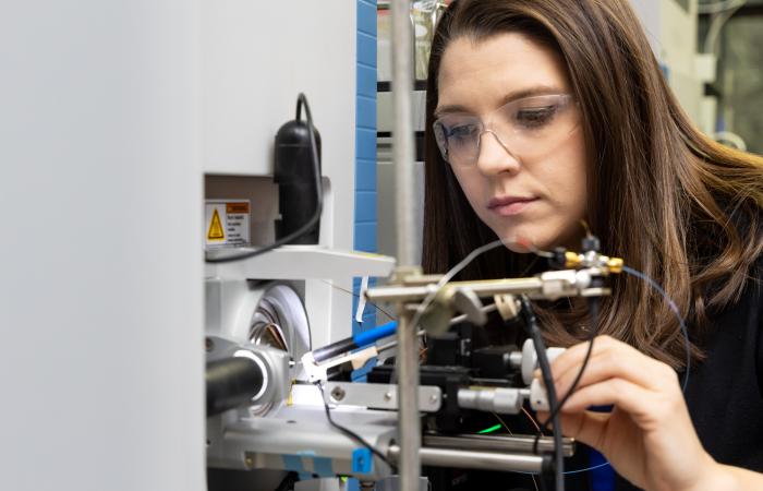 Samantha Peters co-designed and conducted experiments using ORNL’s high-performance mass spectrometry techniques to prove that bacteriophages deploy genetic code-switching to overwhelm and destroy host bacteria. Credit: Genevieve Martin, ORNL/U.S. Dept. of Energy