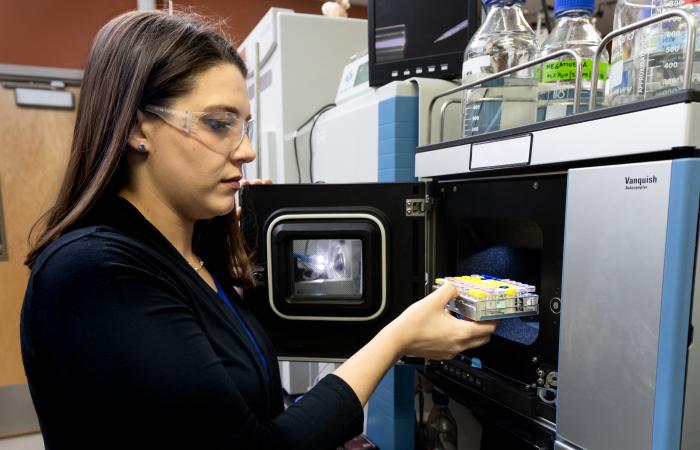 Samantha Peters co-designed and conducted experiments using ORNL’s high-performance mass spectrometry techniques to prove that bacteriophages deploy genetic code-switching to overwhelm and destroy host bacteria. Credit: Genevieve Martin, ORNL/U.S. Dept. of Energy