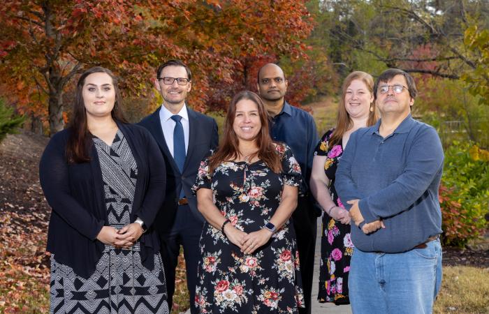 Radiation Safety Information Computational Center staff gather to observe the center’s 60th anniversary. From left, Samantha Bowman, Tim Valentine, Emma York, Ravindra Gadi, Lauren LaLuzerne and Mark Baird. Rebecca Gregor is not shown. Credit: Genevieve Martin, ORNL/U.S. Dept. of Energy