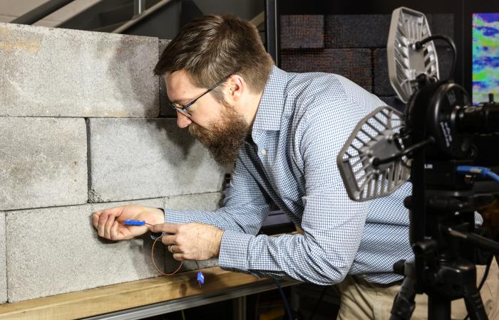 ORNL researcher Philip Boudreaux led the development of a leak detection system that pinpoints the source of drafts in a building. Credit: ORNL, U.S. Dept. of Energy