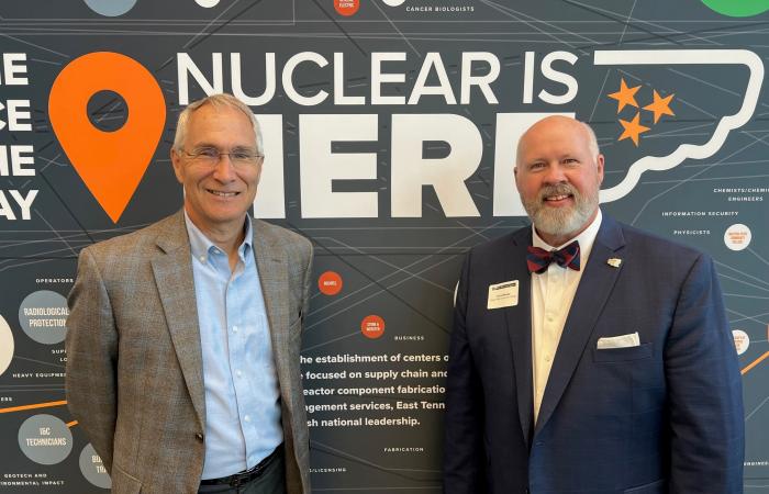 During the Nuclear Opportunities Workshop on August 2, UT-Battelle’s Jeff Smith presented Roane State President Chris Whaley with a $100,000 check to help launch a Nuclear Technology Program at the college. Credit: ORNL, U.S. Dept. of Energy