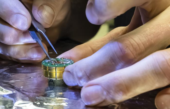 Connecting  wires to the interface of the topological insulator and superconductor enables probing of novel electronic properties. Researchers aim for qubits based on theorized Majorana particles. Credit: Carlos Jones/ORNL, U.S. Dept. of Energy