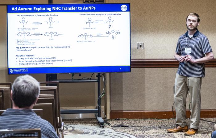 Nathaniel Dominique presents his research talk, “Ad Aurum: Turning Fold Nanoparticle Surfaces with N-Heterocyclic Carbenes.” Credit: Carlos Jones/ORNL, U.S. Dept. of Energy