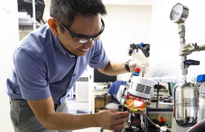 Christian Salvador is studying natural and manmade aerosols at Oak Ridge National Laboratory to improve our understanding of how atmospheric pollutants affect ecosystems and the Earth’s climate. Credit: Carlos Jones/ORNL, U.S. Dept. of Energy