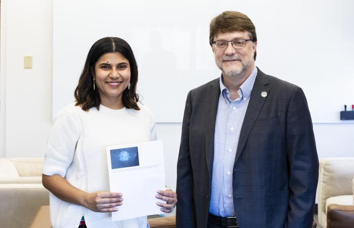 Pal poses with ORNL Director Stephen Streiffer after receiving the award. Credit: ORNL, U.S. Dept of Energy