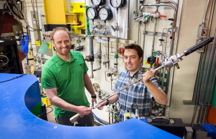 ORNL’s Andrew Christianson and Stuart Calder conducted neutron diffraction studies at the lab’s High Flux Isotope Reactor to clearly define the magnetic order of an osmium-based material. Image credit: ORNL/Genevieve Martin