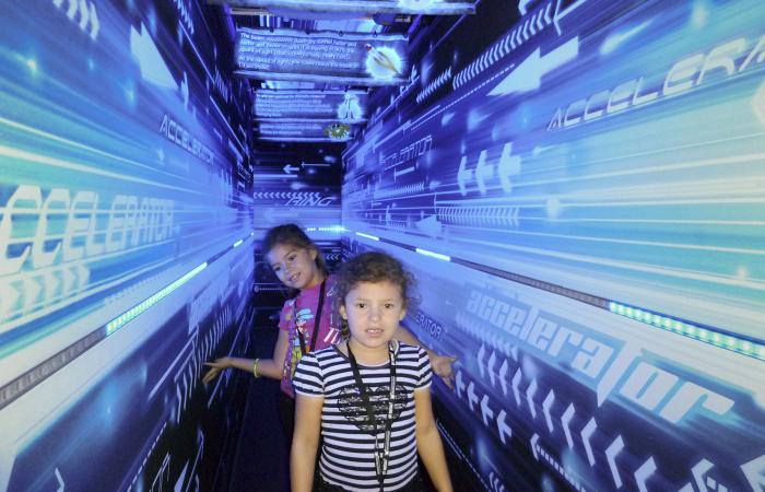 Emily Keith (foreground) and her sister Alanie Keith, daughters of ORNL materials scientist Nidia Gallego, were among nearly a thousand youngsters who visited the lab in 2014 for “Take Your Child to Work Day,” an event Gallego spearheaded.