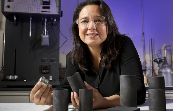 For NASA’s Mars 2020 rover mission, Nidia Gallego produces components of carbon-bonded carbon fiber (CBCF, in gray) for insulating an iridium-clad plutonium heat source power supply (inert prototype shown in silver).