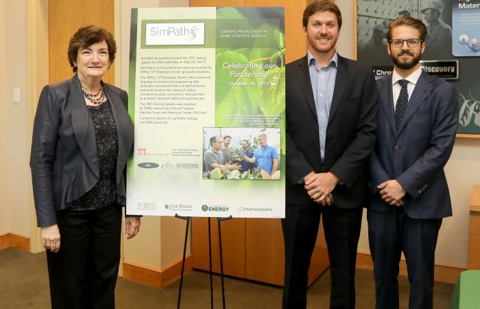 Michelle Buchanan, deputy for science and technology at Oak Ridge National Laboratory, and Robert Moseley and Ben Mohr of SimPath signed an agreement for SimPath to license a novel ORNL cloning system that assembles the biological building blocks necessar