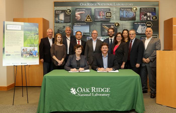 Teams from Oak Ridge National Laboratory and industry startup SimPath celebrate their collaboration during a technology license signing ceremony. Knoxville, Tenn.-based SimPath will further develop ORNL’s cloning method into a multi-gene DNA assembly kit 