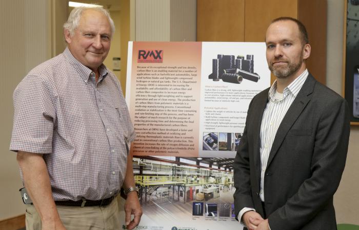 ORNL carbon fiber processing technology co-invented by Felix Paulauskas (left) has been licensed to RMX Technologies, represented by vice president for research and development Truman Bonds.