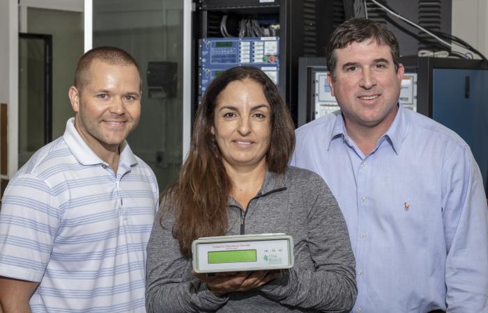 L-R, Researchers Nils Stenvig, Isabelle Snyder and Travis Smith are developing tools and deploying sensors to aid decision-making as Puerto Rico rebuilds and modernizes its power grid.